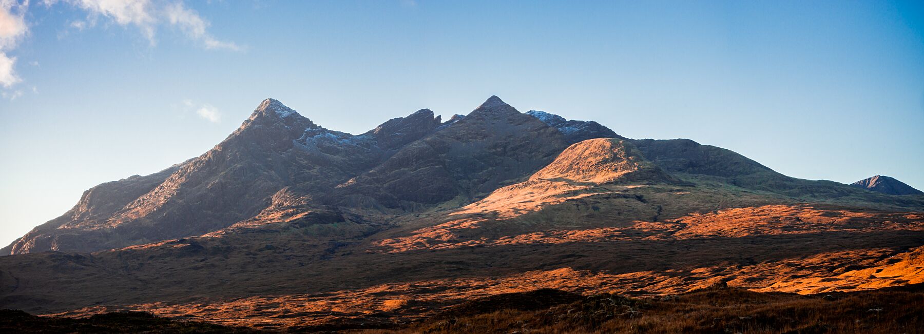 The Cuillin mountains, Isle of Skye, with the Autumn sunrise catching the peaks of Sgurr-nan-Gillean, Am Bhasteir and Sgurr-a-Bhasteir.
This amazing landscape print is available in A3, A2 and A1 sizes, as print only, or with a choice of wooden frames in White, Black and Oak.