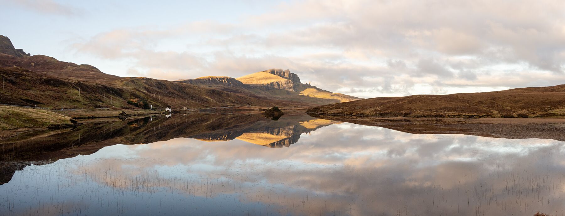 A calm day at Loch Fada with the Old Man of Storr reflected in its still waters.
This amazing landscape is available in A3, A2 and A1 sizes, as print only, or with a choice of wooden frames in White, Black and Oak
