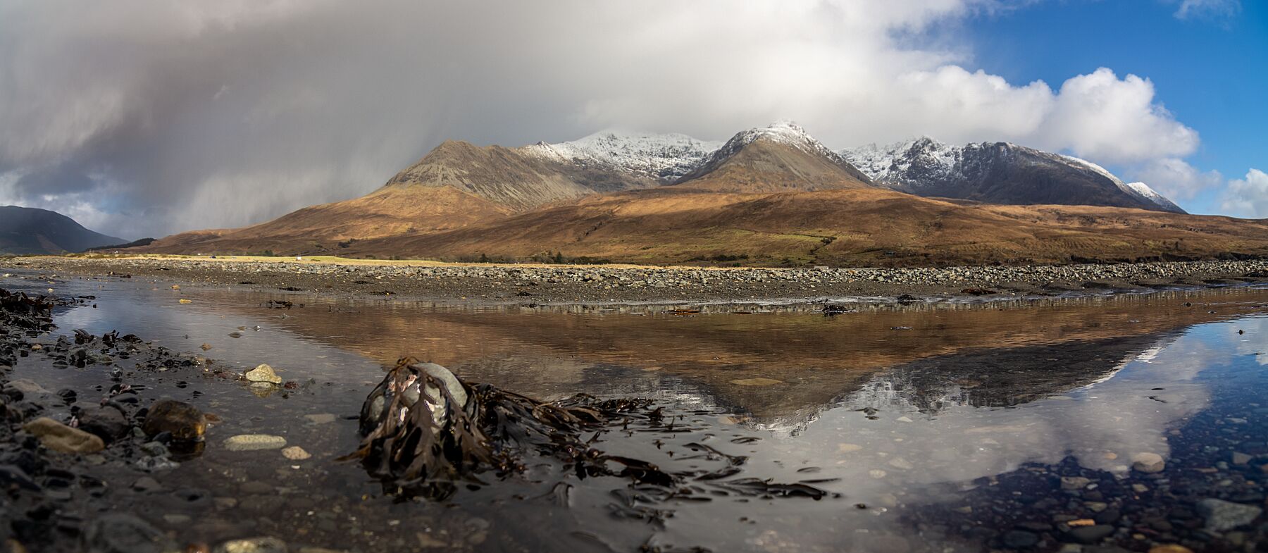 Reflections of the snowy, Cuillin Ridge in the receding tide at Glen Brittle Beach.
 
This amazing landscape print is available in A3, A2 and A1 sizes, as print only, or with a choice of wooden frames in White, Black and Oak