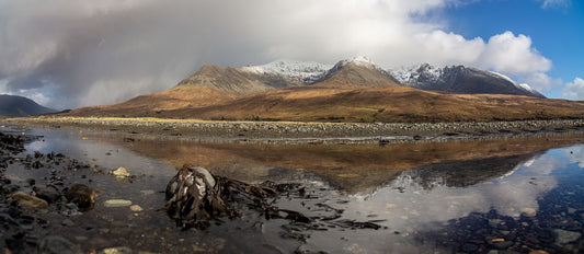 Reflections of the snowy, Cuillin Ridge in the receding tide at Glen Brittle Beach.
 
This amazing landscape print is available in A3, A2 and A1 sizes, as print only, or with a choice of wooden frames in White, Black and Oak