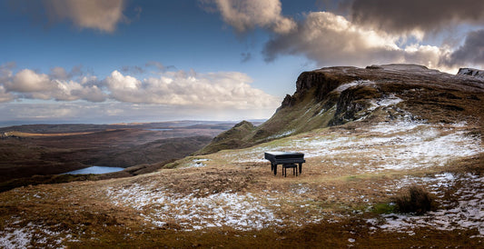 This baby grand piano was temporarily abandoned at the Quiraing, when a sleet storm interrupted the filming of a music video, creating a surreal scene in this epic landscape.
This unique landscape is available in A3, A2 and A1 sizes, as print only, or with a choice of wooden frames in White, Black and Oak.