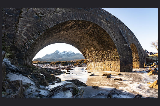 The Black Cuillin ridge framed by the old Sligachan bridge, and a frozen Sligachan river.
 
This amazing landscape is available in A3, A2 and A1 sizes, as print only, or with a choice of wooden frames in White, Black and Oak