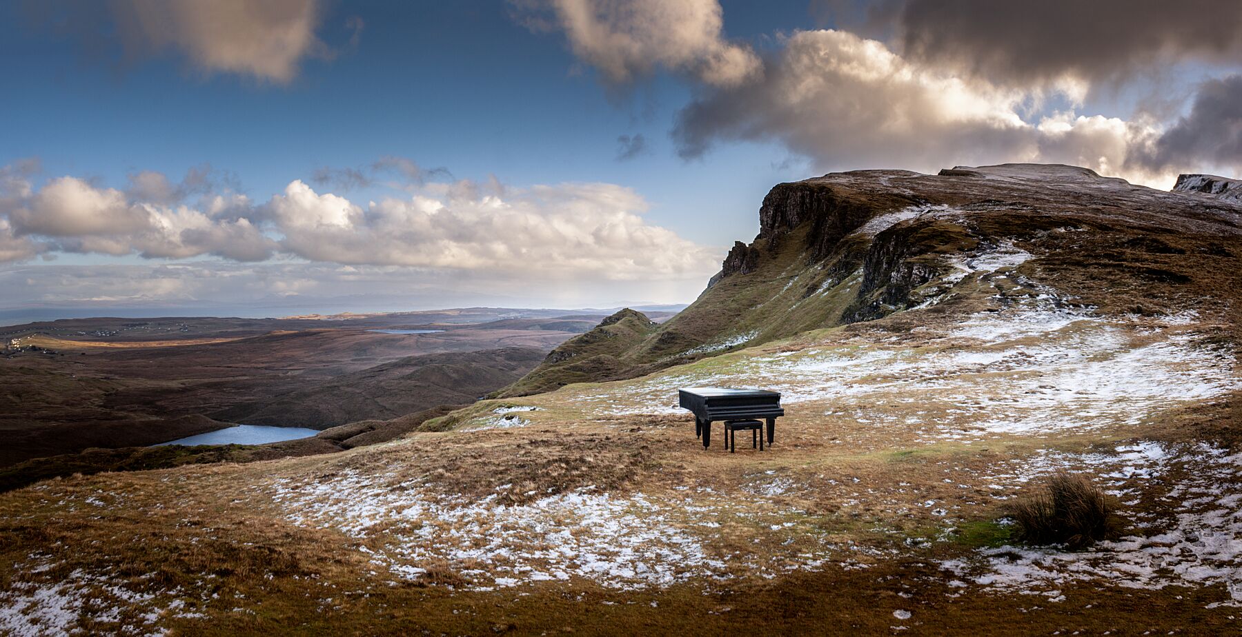 This baby grand piano was temporarily abandoned at the Quiraing, when a sleet storm interrupted the filming of a music video, creating a surreal scene in this epic landscape.

This unique landscape is available in A3, A2 and A1 sizes, as print only, or with a choice of wooden frames in White, Black and Oak.
