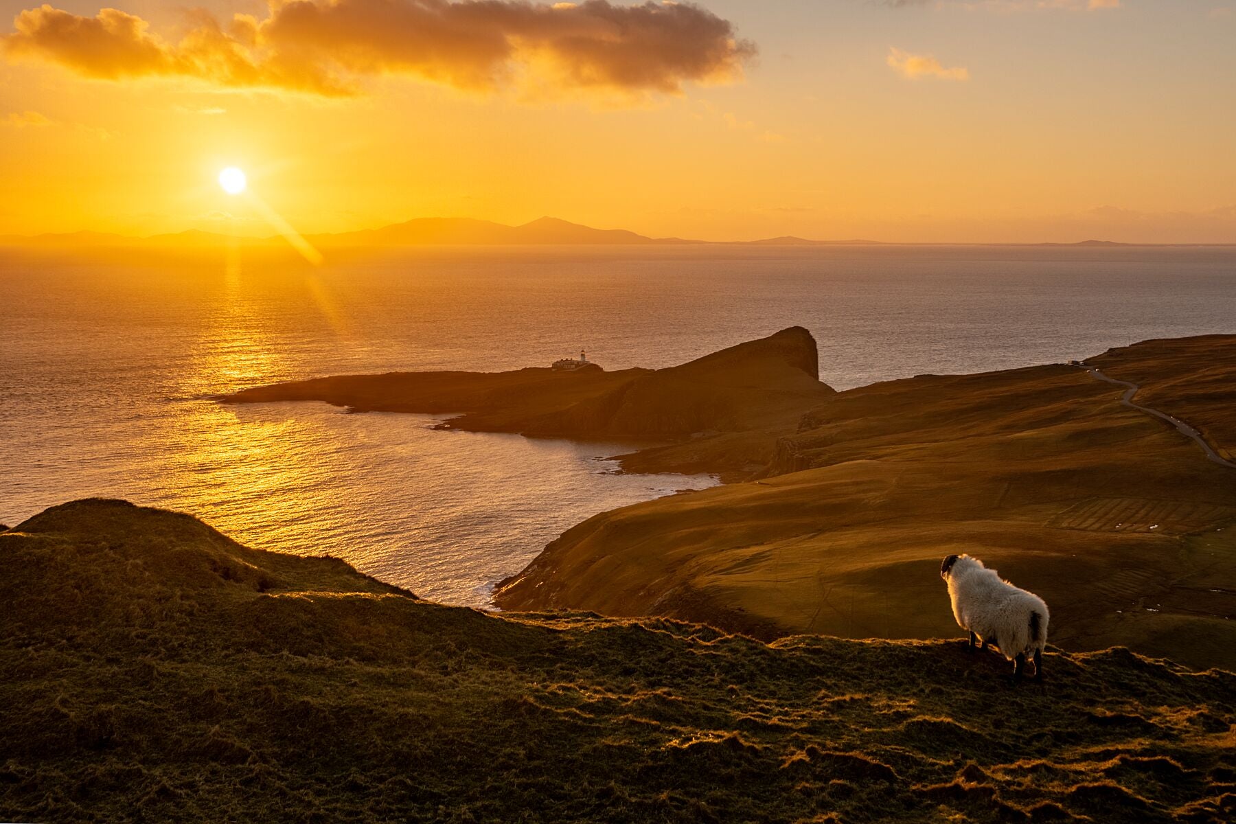Sunset over South Uist, viewed from above Neist Point, the Isle of Skye's most Westerly headland.

This unique landscape is available in A3, A2 and A1 sizes, as print only, or with a choice of wooden frames in White, Black and Oak.
